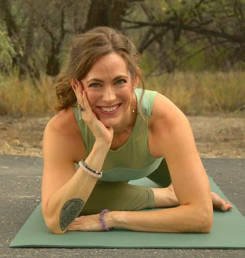 Katie smiling in pigeon pose